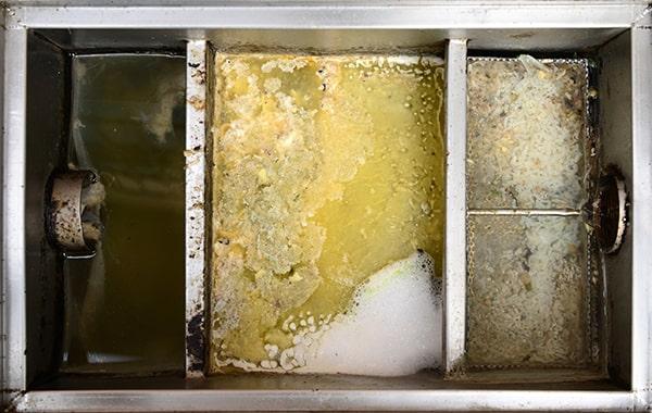 neglecting grease interceptor cleaning can lead to foul odors, backed-up plumbing, and pricey repairs in the kitchen